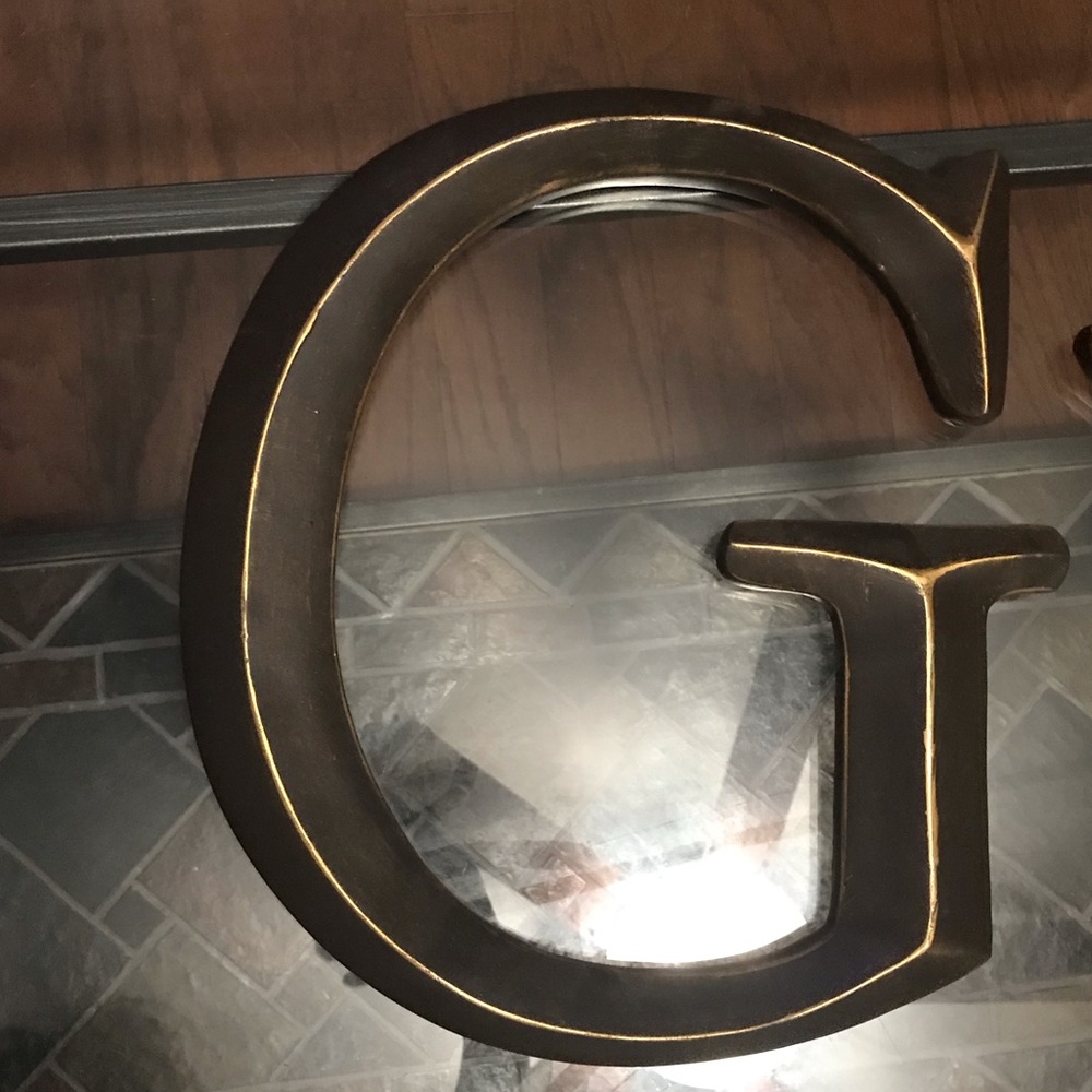 Bronze letter G